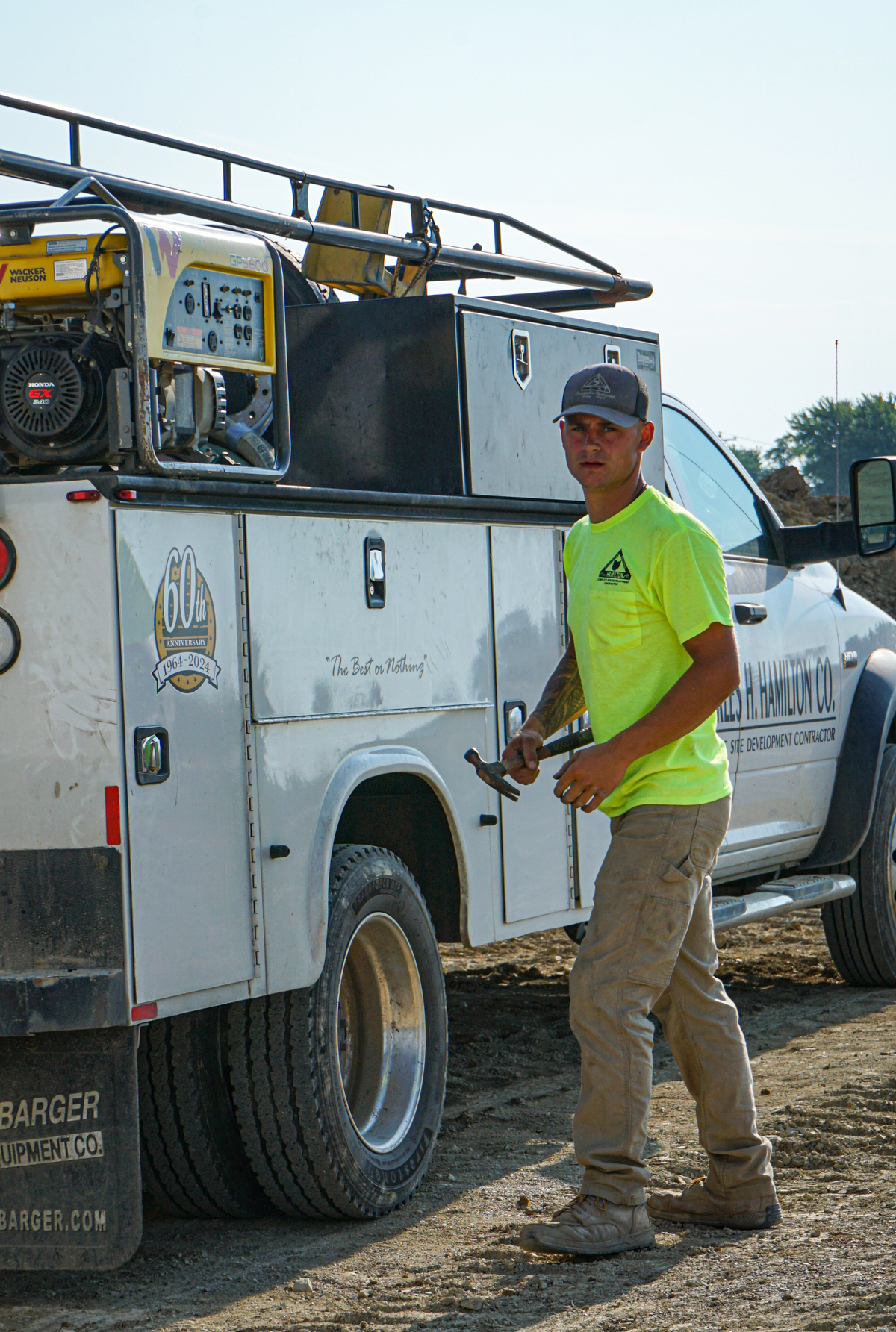 worker in front of ch hamilton truck
