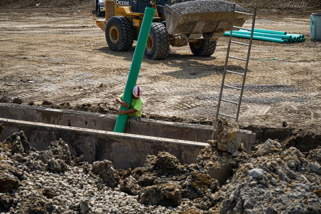 installing underground pipes