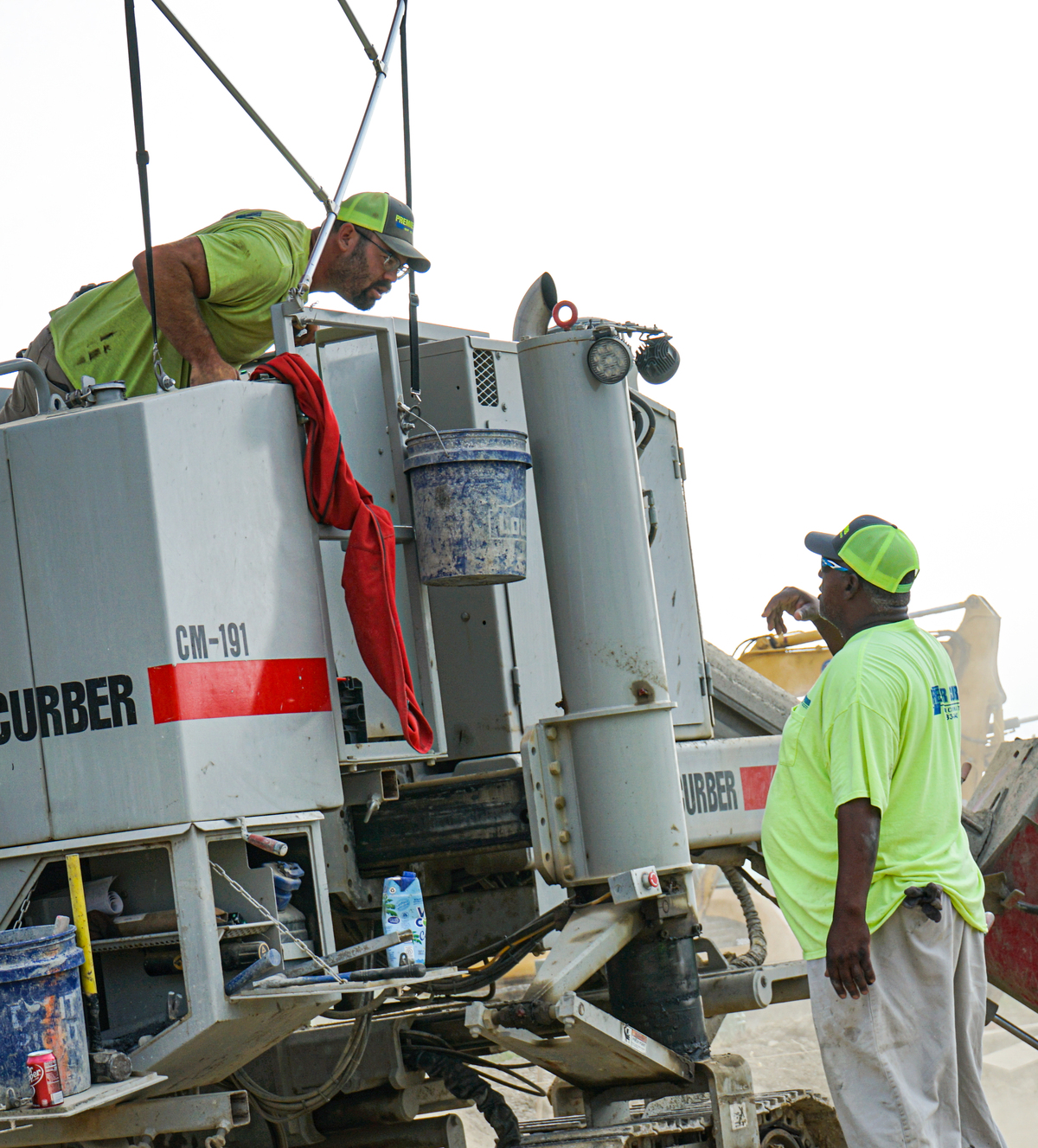 two men using a curber