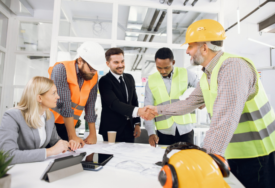 contractors in hard hats meeting with clients